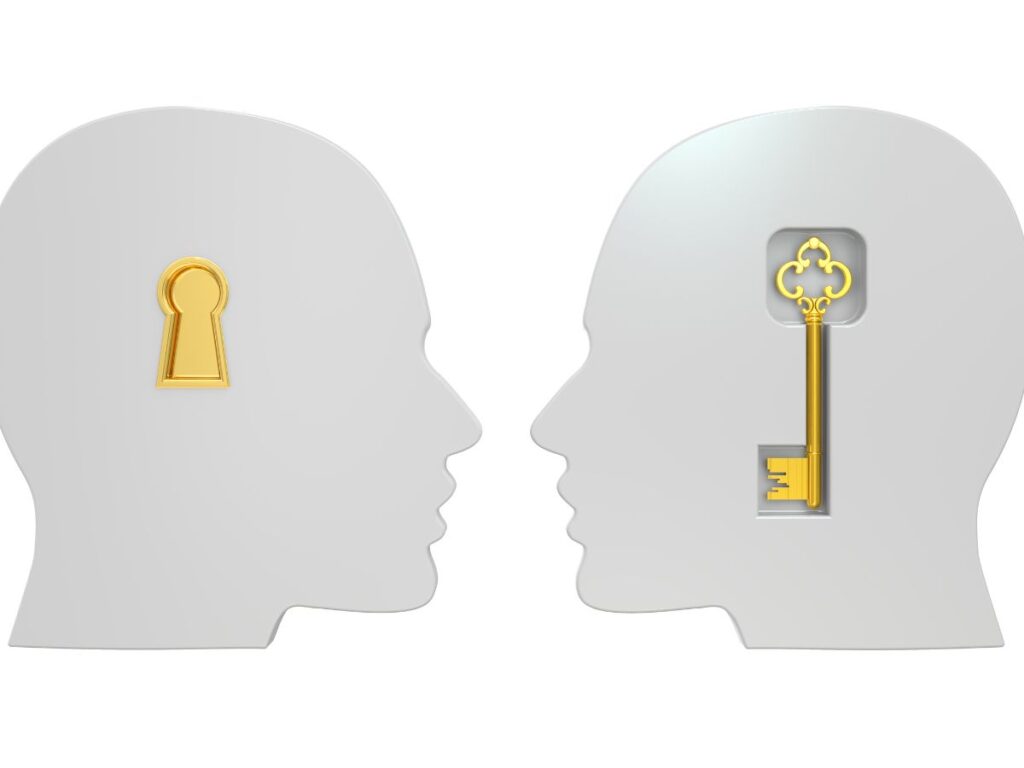 Two head silhouettes with a key and keyhole symbolizing access control