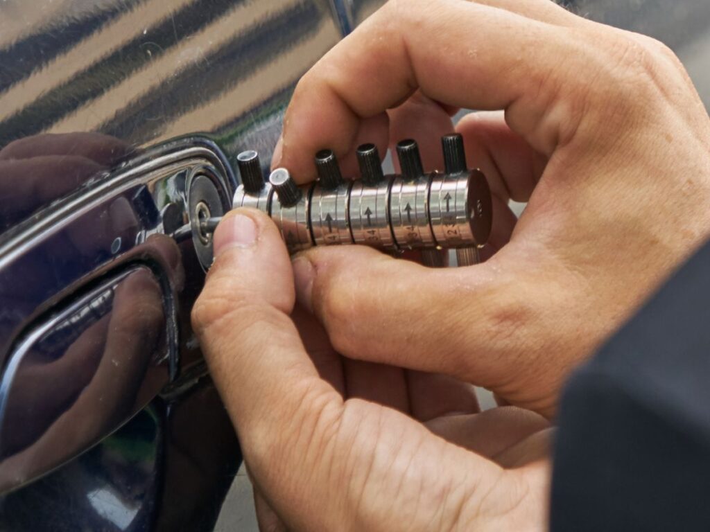 Locksmith tool being used in a car door lock